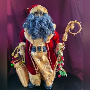 African American Santa with gold staff and Gift Bag